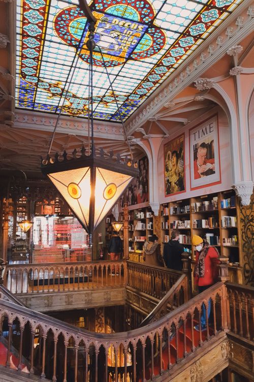 Free Stunning interior of Livraria Lello bookshop in Porto, featuring stained glass and ornate woodwork. Stock Photo