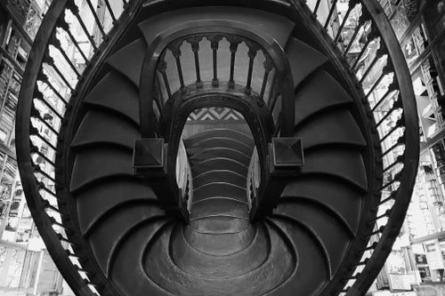 Free Monochrome image of a spiral staircase, a stunning architectural design in Porto, Portugal. Stock Photo