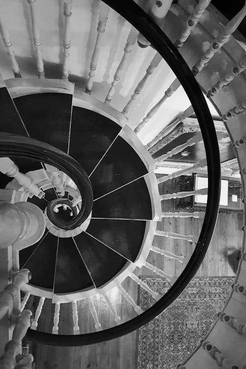 White Spiral Staircase With Black Metal Railings