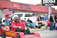 Man in Red Jacket Riding Red Car