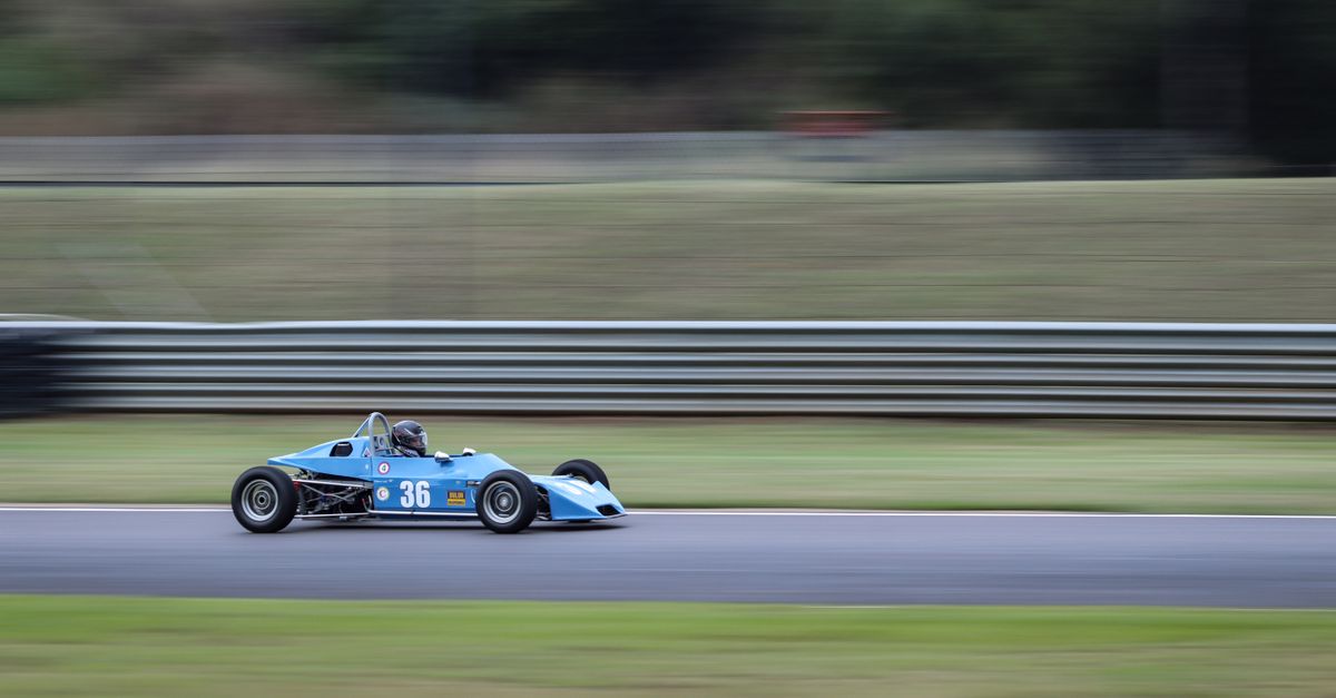 Blue Racing Cart Blue Racing Car on Asphalt Road · Free Stock Photo