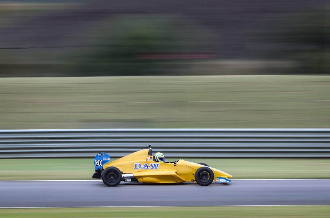 Photo of a Racing Car on the Speedway