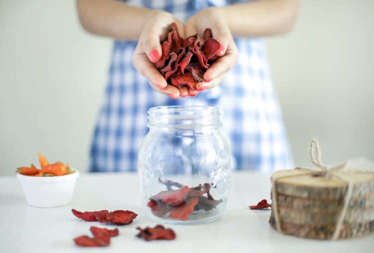 Woman Holding Dried Fruit In Hands