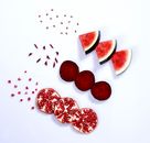 Slices of Red Fresh Fruits on a White Surface