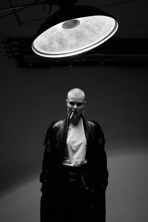 Grayscale Photo of a Bald Woman