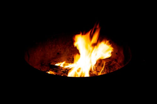 Free Fire in Black Round Fire Pit Stock Photo