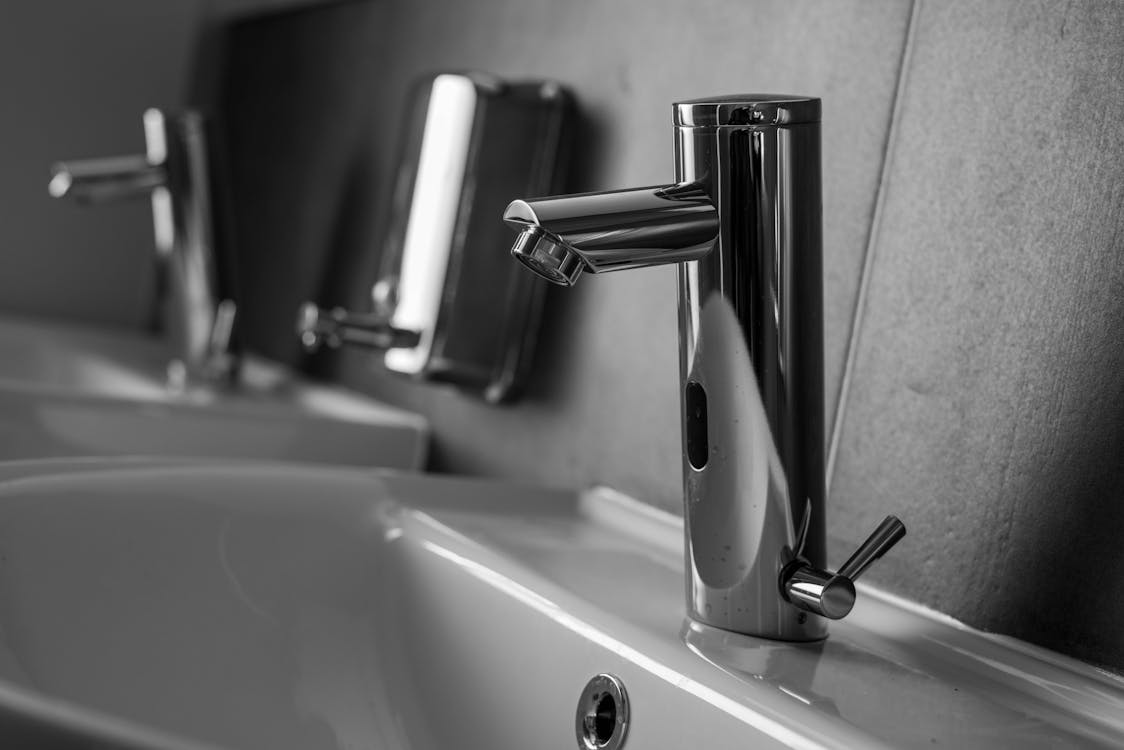 Stainless Steel Faucet on White Ceramic Sink