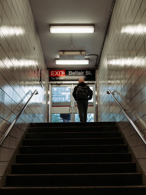 Man at Top of Stairs at Subway Exit