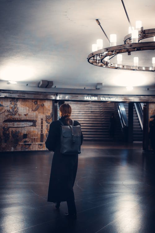 Woman Walking in a Subway Station