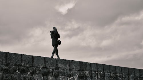 A Person Walking on a Wall