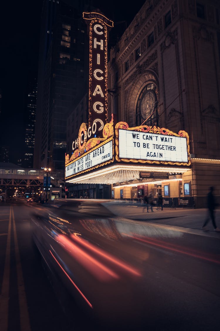 Lit Up Marquees Of Chicago Theatre At Night In Chicago, USA