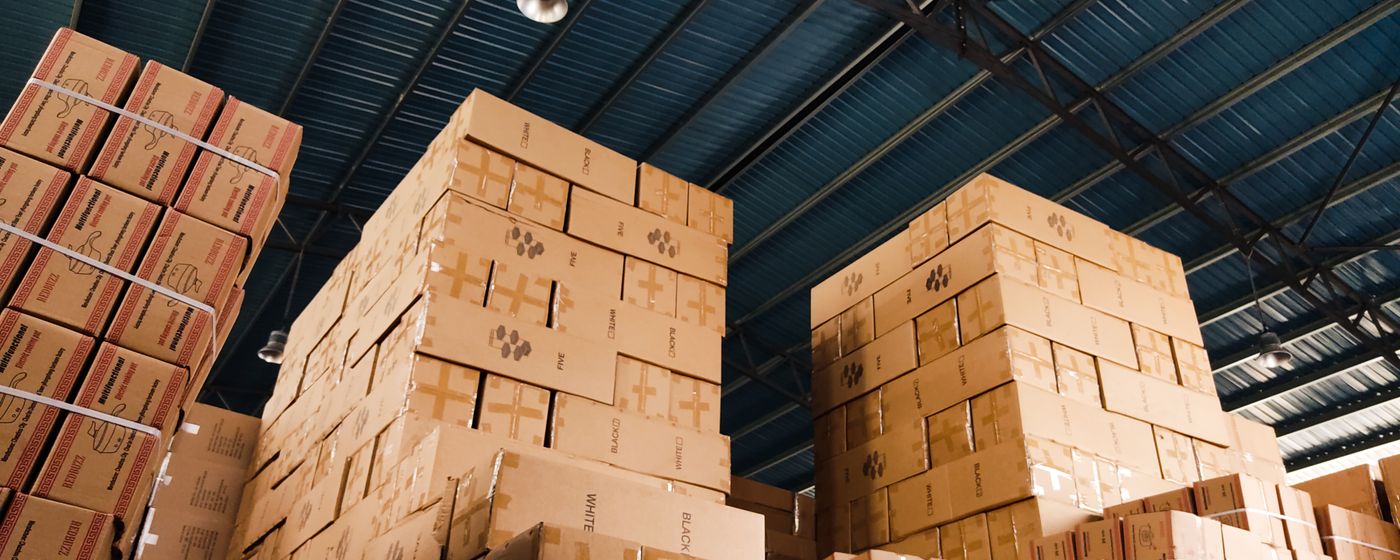 Stacked boxes in organized warehouse