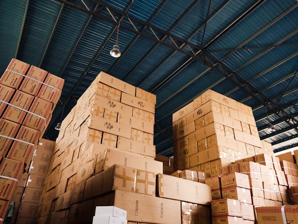 stacks of multiple carton boxes in a storage facility