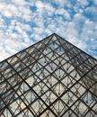 Steel Framed Building with Glass Windows under a Cloudy Sky