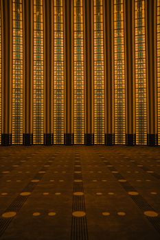 View of vertical patterned windows in a spacious architectural interior.