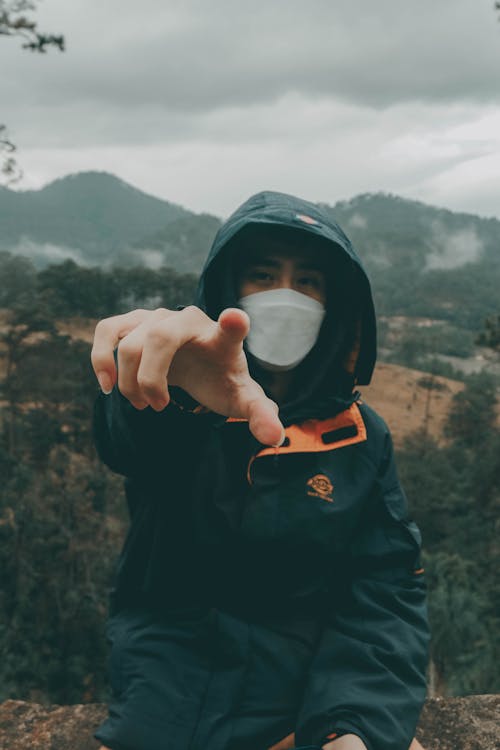 Free Person in Black Hoodie Pointing His Finger Stock Photo
