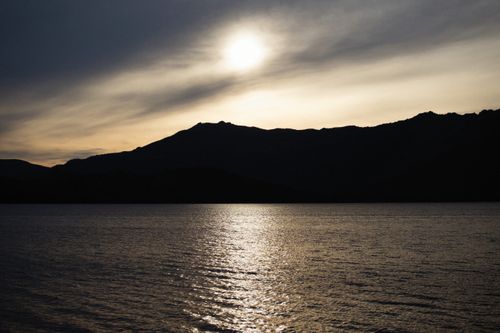 Silhouette Of Mountain Near Body Of Water · Free Stock Photo