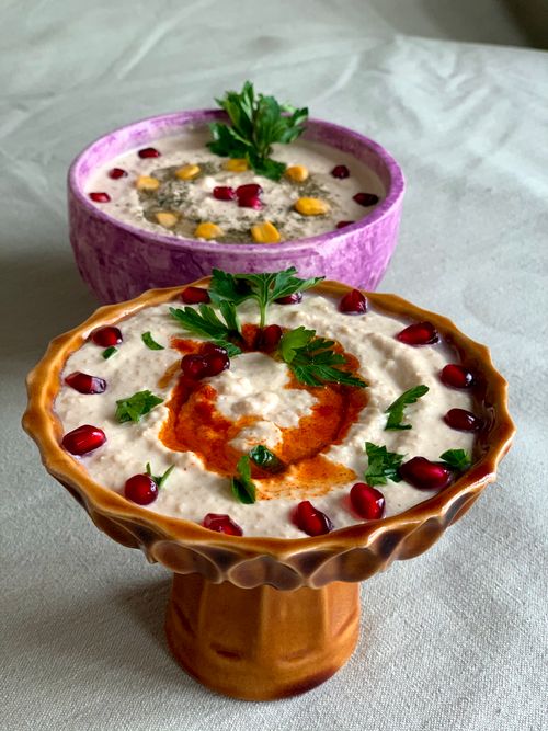 Free Close-up of traditional Turkish meze bowls with vibrant garnishes, perfect for dining inspiration. Stock Photo
