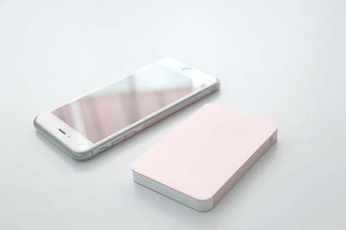 Free stock photo of mobile phone with power bank Stock Photo