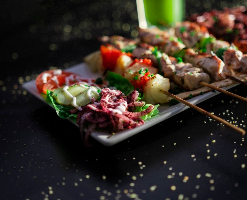 Grilled chicken skewers served with salad