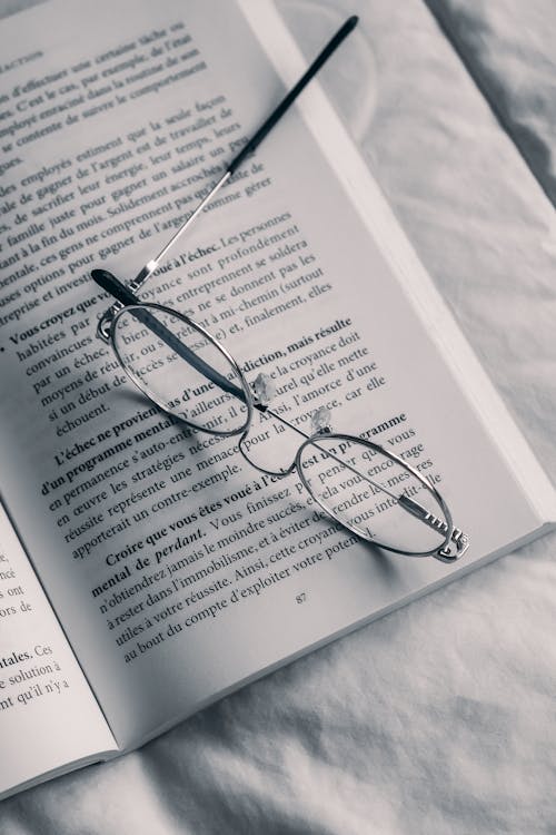 Photo of Eyeglasses on a Book