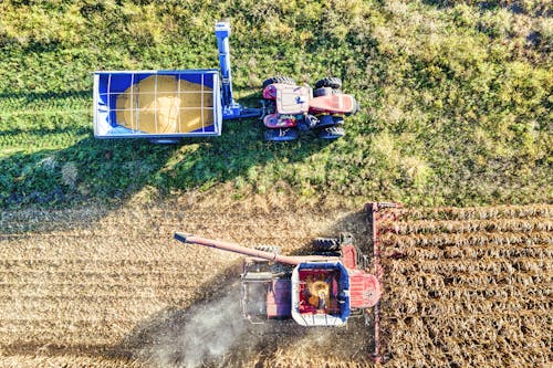 A Truck Harvesting A Field