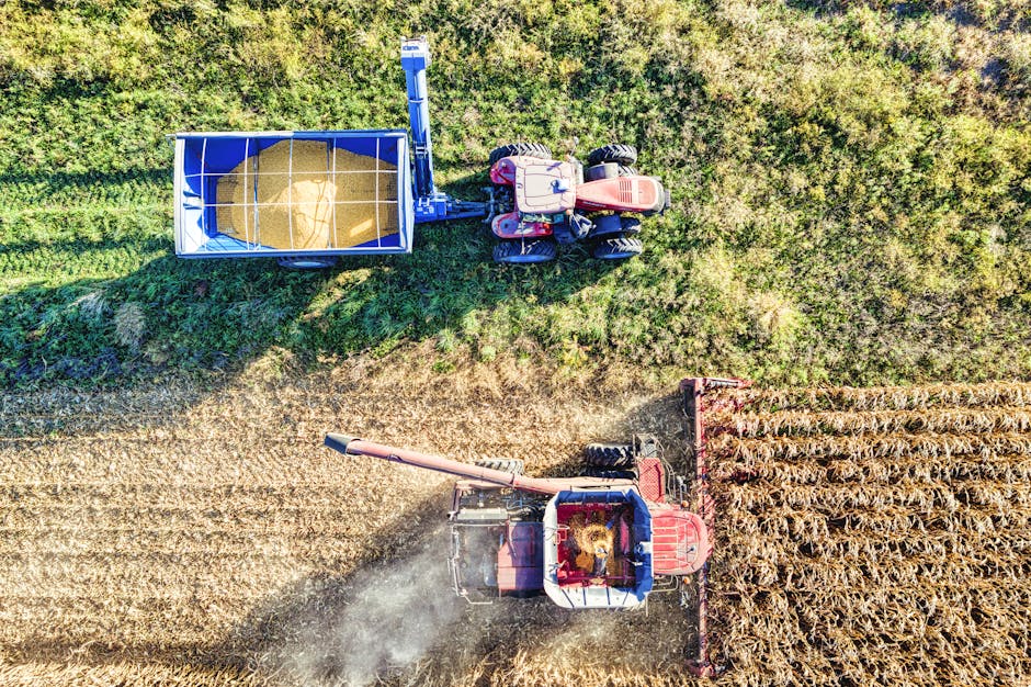 How State Farm Bundle Discount Works for Combining Home and Auto Insurance Aerial drone shot capturing a tractor harvesting corn in a Minnesota field during fall.