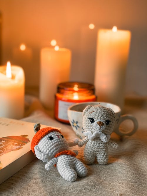 Free Crochet Dolls Near Lighted Candles Stock Photo