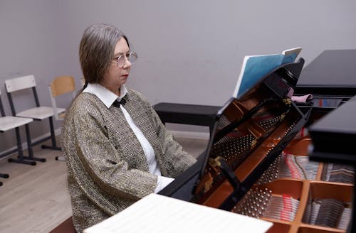 Woman Wearing Eyeglasses Playing Piano 