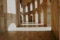 Brown and White Hallway With White Walls