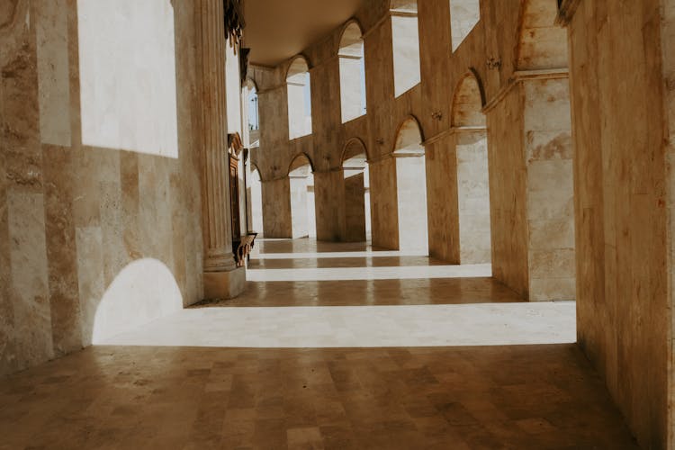 Brown And White Hallway With White Walls