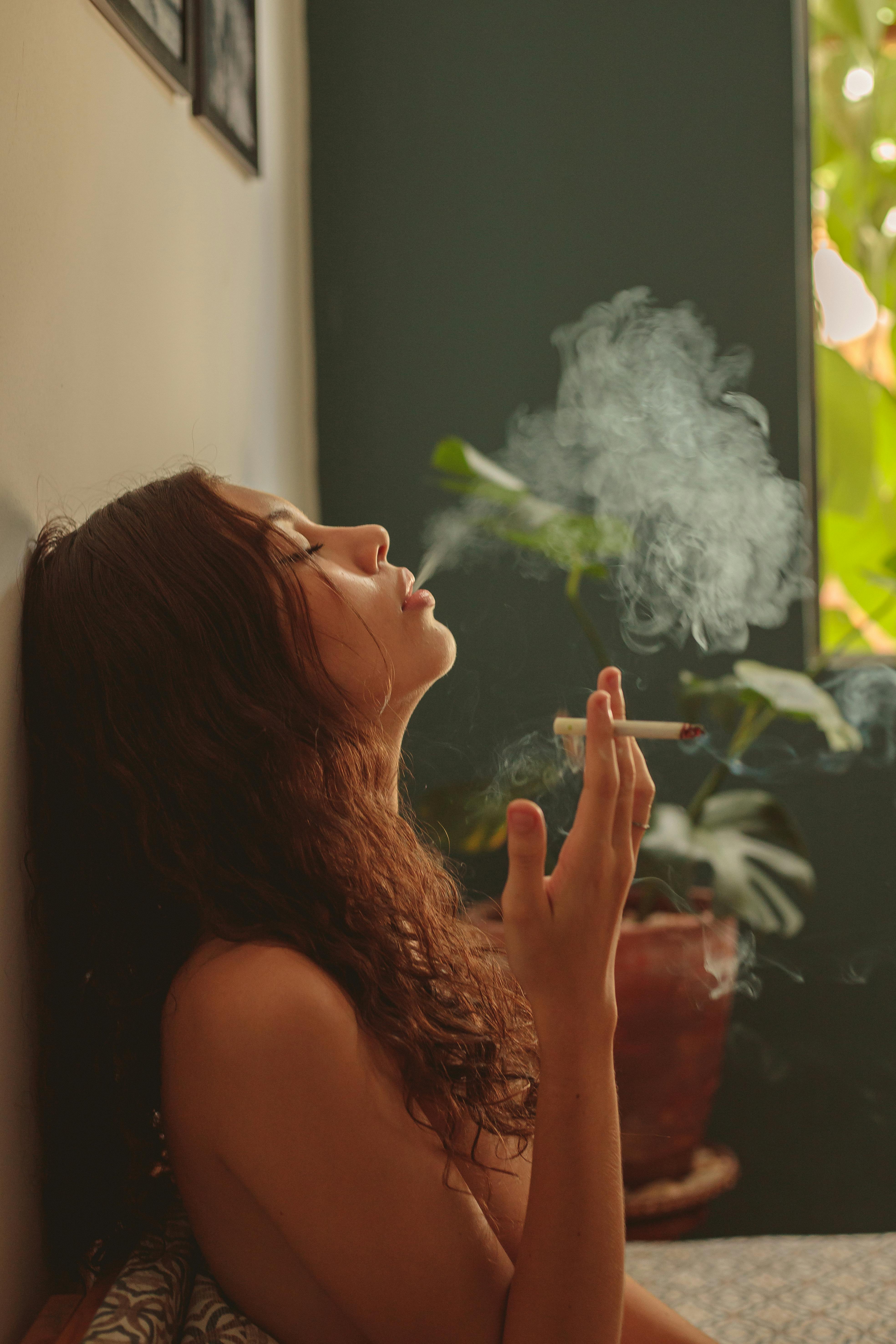 Topless Woman Smoking Cigarette · Free Stock Photo