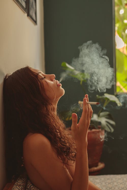 Free Topless Woman Smoking Cigarette Stock Photo