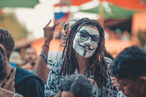 Free A Person with Dreadlocks Wearing a Mask Stock Photo