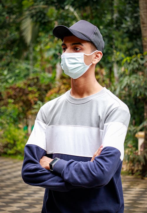 Man in Long Sleeve Shirt Wearing Face Mask