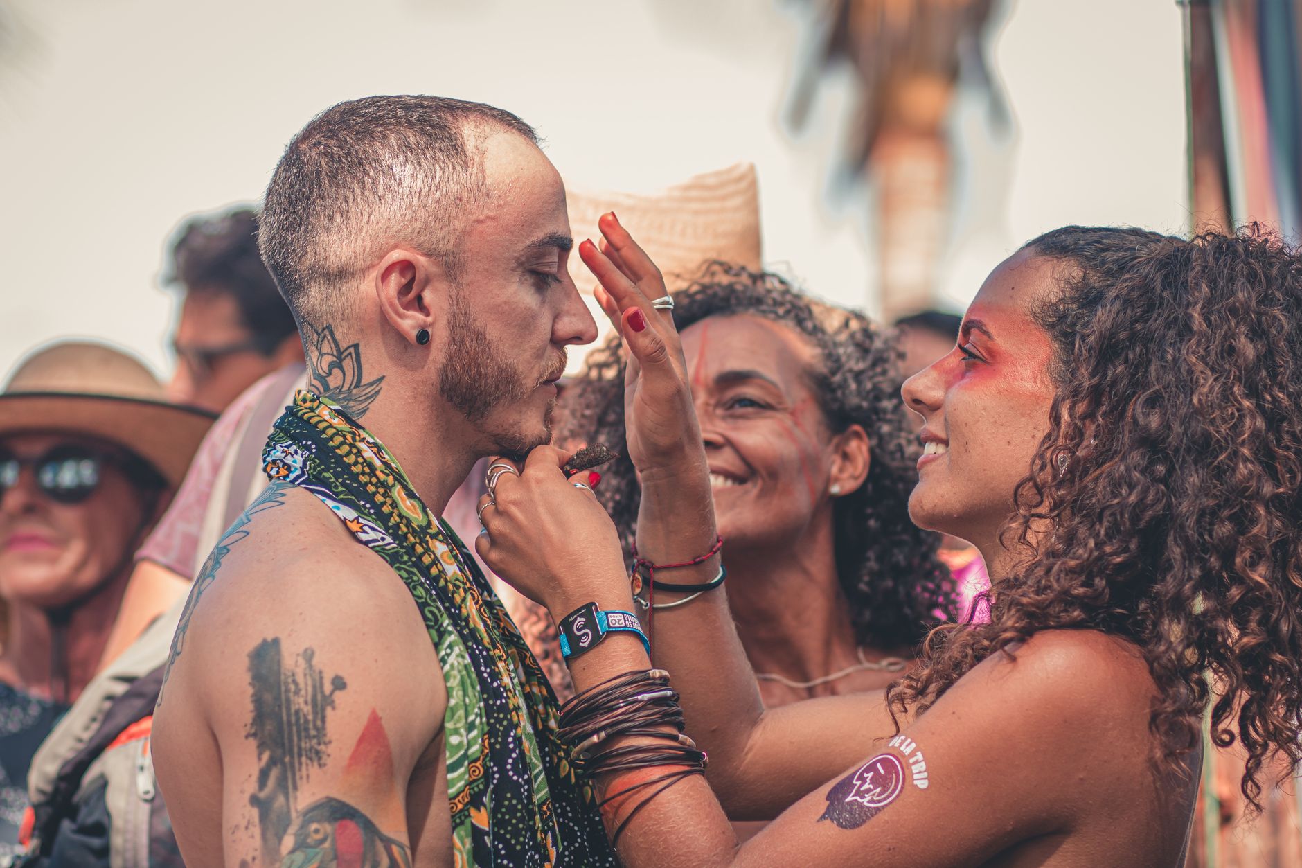 Group of friends at celebration wearing InkToday temporary tattoos on visible skin
