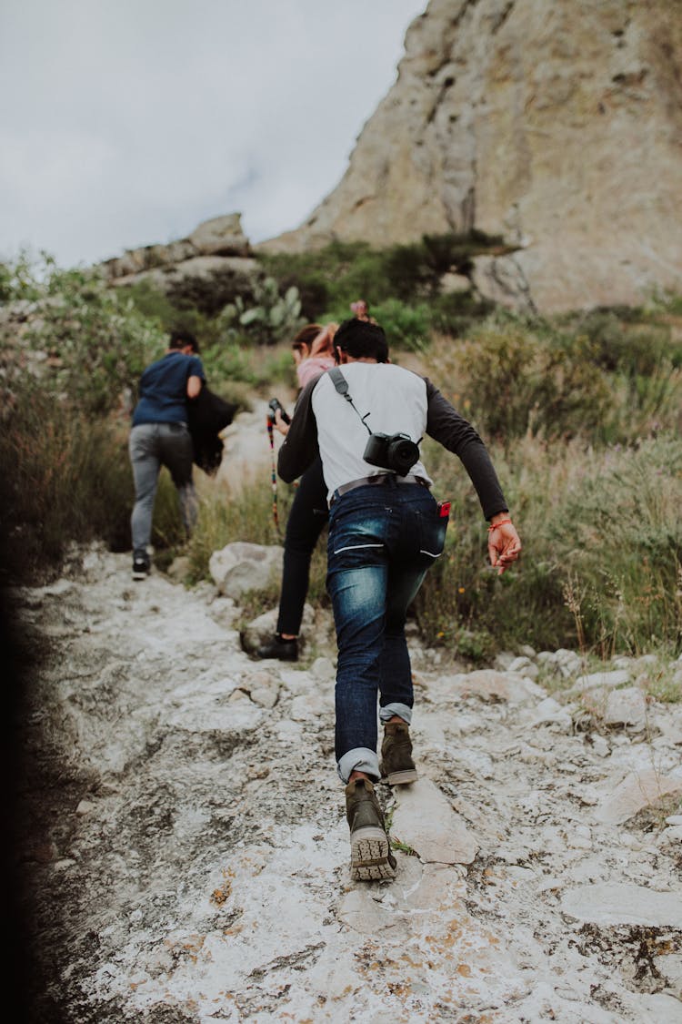 People Hiking On A Steep Path 