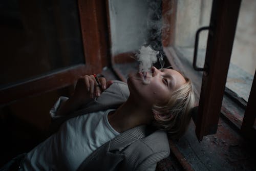 Woman in Gray Blazer Smoking 
