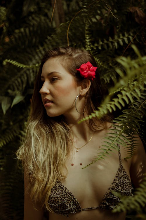 Free Portrait of Young Woman with Flower in her Hair  Stock Photo