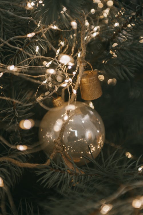 Close Up Photo of Christmas Lights and a Christmas Ball