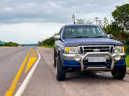 A Pickup Truck Parked by the Roadside