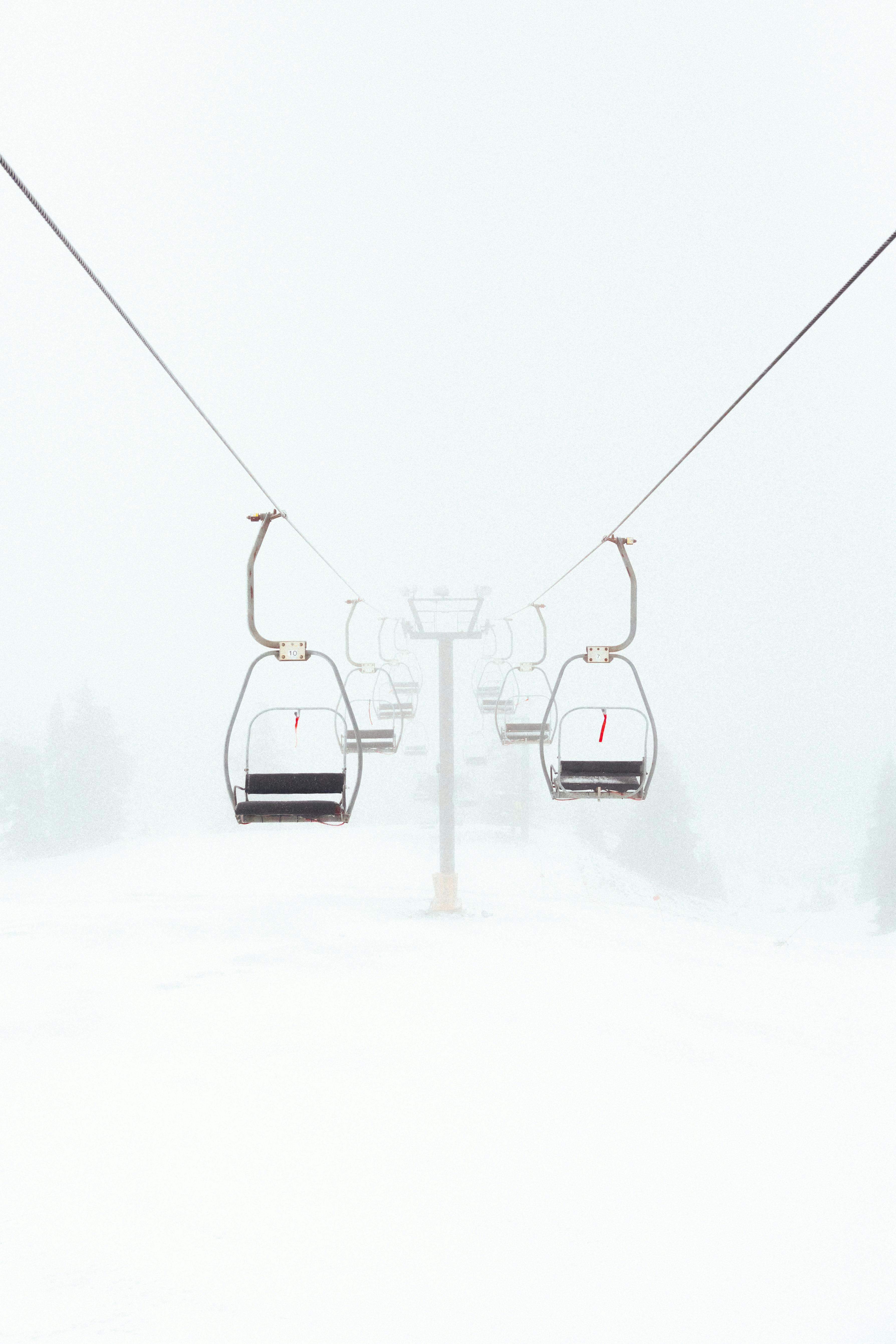 black cable cars on snow covered ground