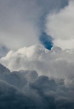 A dramatic formation of white clouds against a blue sky, captured in Turkey.