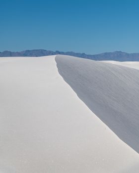 White Sands National Monument with bright dunes and clear blue sky in New Mexico.