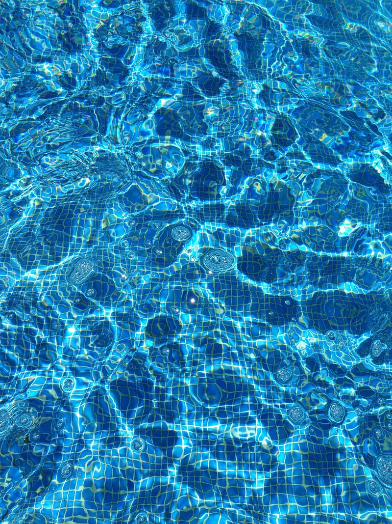 Well-maintained pool with paving