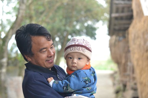 Free A Man Holding his Son Stock Photo