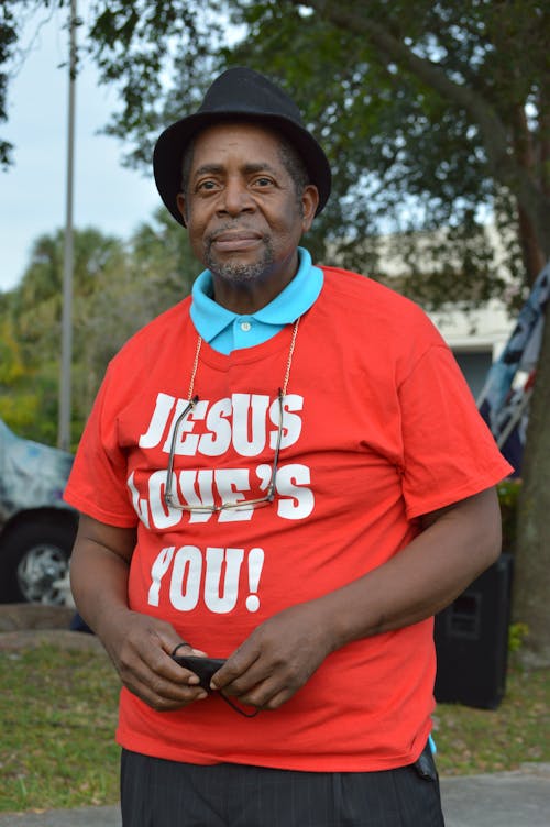 A Man in a Jesus Loves You Shirt