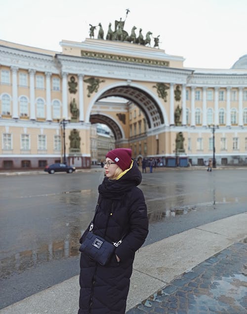 A Woman Standing near the General Staff Building in Saint Petersburg