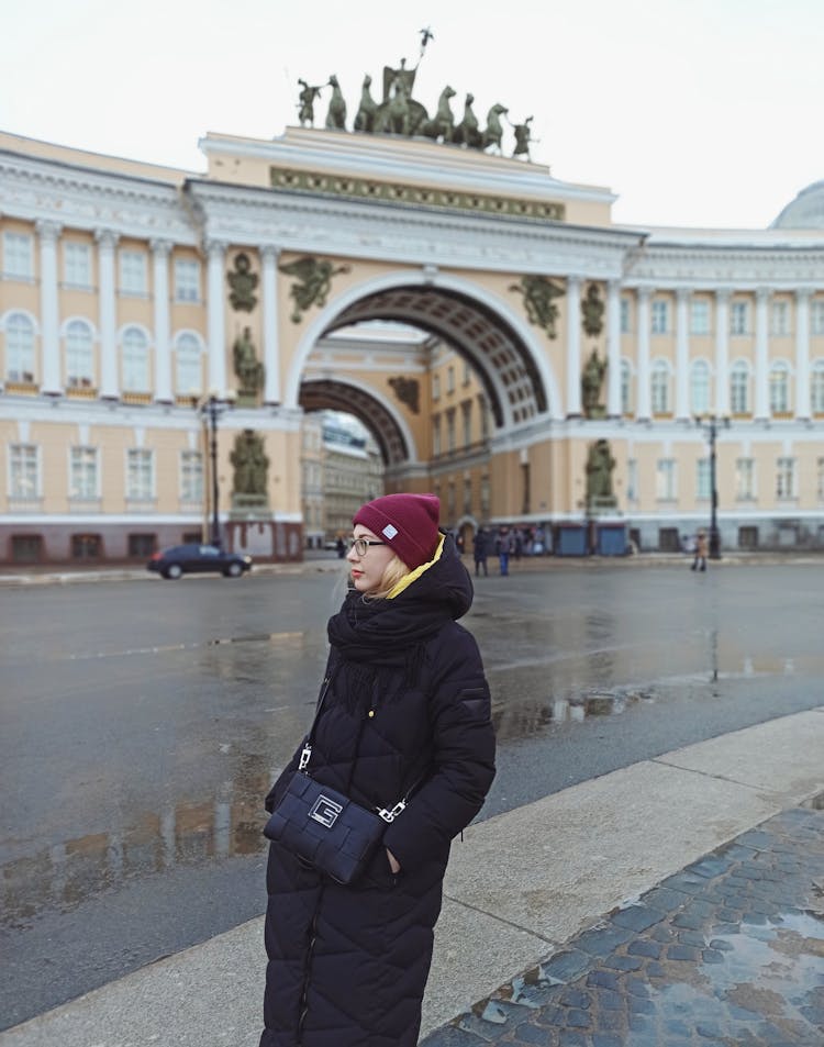 A Woman Standing Near The General Staff Building In Saint Petersburg