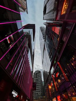A dynamic cityscape with towering skyscrapers and neon lights, capturing urban energy.